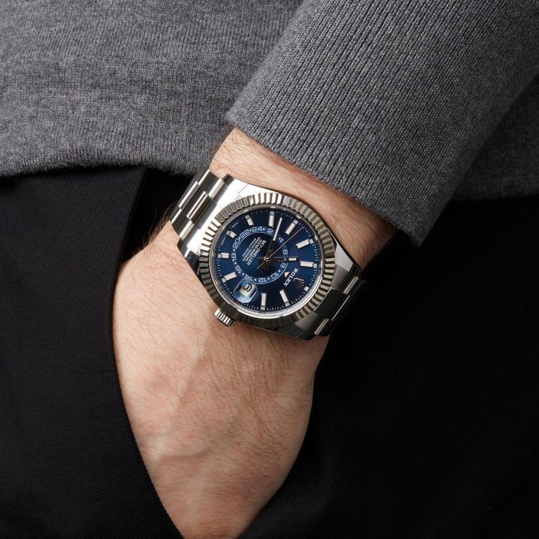The blue dial replica watch has dual time zone.